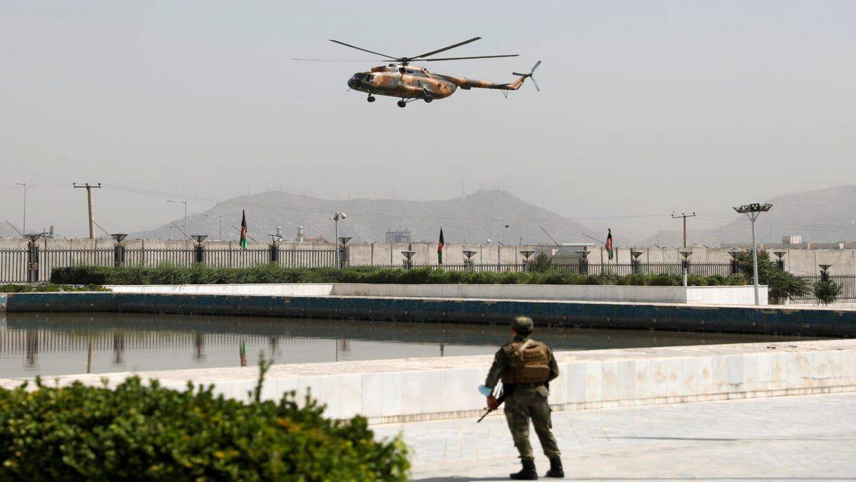FILE PHOTO: A Military Helicopter Carrying Afghan President Ashraf Ghani Prepares To Land Near The Parliament In Kabul